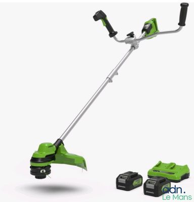 a greenworks corded grass trimmer with two batteries