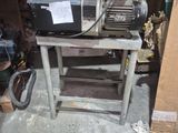 a machine that is sitting on a table in a garage