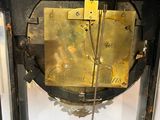 a clock that has a rock inside of it