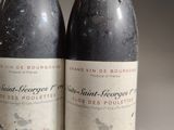 two bottles of wine sitting next to each other on top of a table