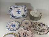 a lot of plates that are sitting on a table
