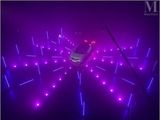 an image of a car in a parking lot with purple lights