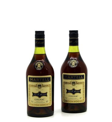 two bottles of wine sitting next to each other on a white surface