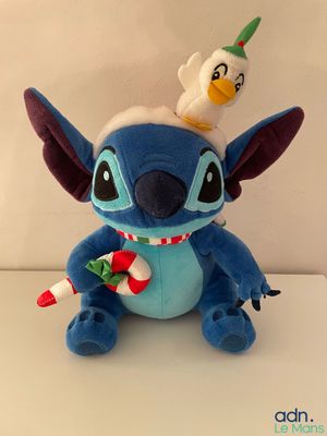 stuffed toy of a stuffed animal with a christmas hat on top of it