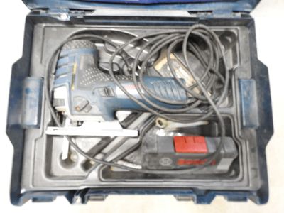 a blue tool box with tools in it on a table