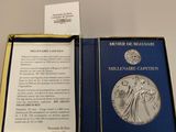 an open book with a picture of a woman holding a medal in it