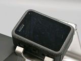 a cell phone that is sitting on top of a stand