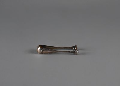 pair of silver spoons on a gray surface