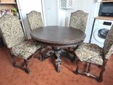 four chairs around a table in the kitchen