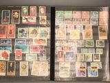 a large collection of stamps and stamps on display in a case