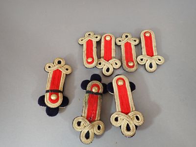 five red and white skateboards on a gray surface