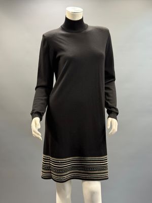 a mannequin dress with black and gold stripes on a mannequin mannequin mannequin mannequin mannequin mannequin manne