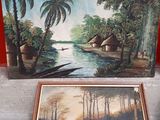 a picture of a painting and a vase on a table