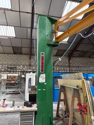 a picture of a large green machine in a building