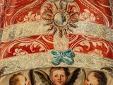 an image of a painting of three angels on a red and white background