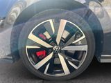 a close up of a car ' s wheel on the street