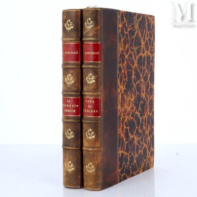 three books sitting on top of each other on a table