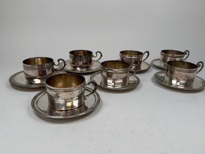 six silverplated cups and saucers with saucers and saucers