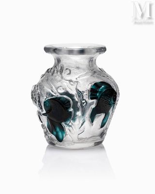 a glass vase that has a blue and black design on it
