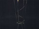 an image of a tall metal sculpture with a bunch of rings on it