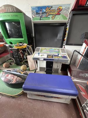 several video game machines and other games in a room
