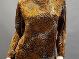 a mannequin mannequin wearing a leopard print top