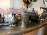 a table with a lot of silver items on top of it