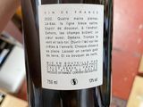 a bottle of wine that is being held by a person