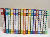 a lot of children ' s books lined up on a table