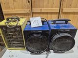 two portable heaters sitting on top of a table next to each other