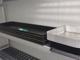 two trays on a shelf in a room