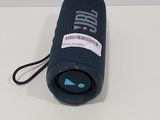 the bluetoothed speaker is sitting on a white surface