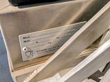 a close up of a metal object with a label on it