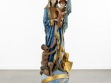an image of a statue of a woman holding a child