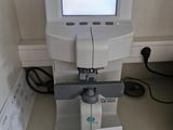 a machine that is sitting on a table with a sign in front of it