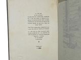 an open book with a picture of a building in the background