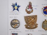 a lot of badges that are on a piece of paper