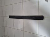 a close up picture of a bathroom wall with a towel rack