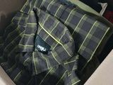 a box with a shirt inside of it on the floor
