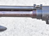 a close up of a gun that is on the ground