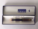 a pen that is in a box on a table