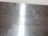a close up of a piece of metal on a table