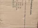 a cardboard box sitting on top of a pile of boxes