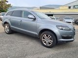 the grey volkswagen suv is parked in a parking lot