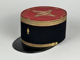 a black hat with a red and gold design on it