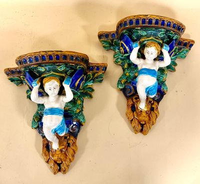pair of wall sconces with cherenshes and leaves in blue and green