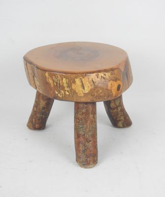 an image of a small wooden stool with two legs on a white background
