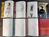 six books with drawings of people in different poses on a table