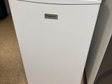 a white refrigerator and a white microwave on the floor