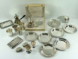 a table with a lot of silver items on it